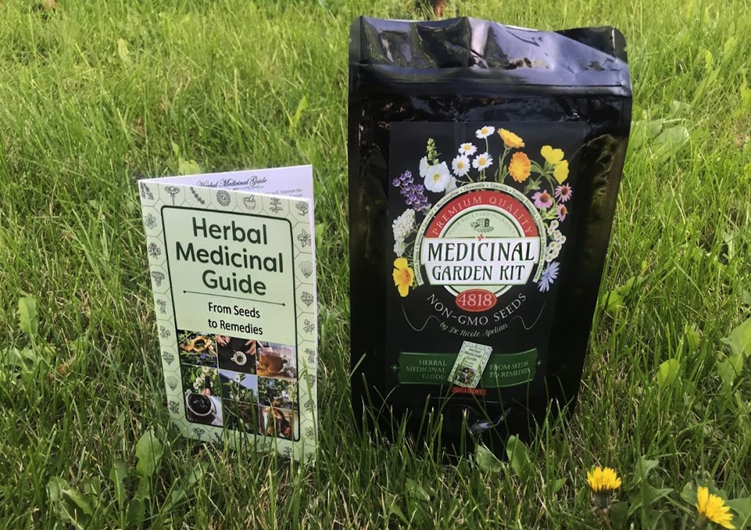 Medicinal Garden Kit and herbal guide photographed outdoors